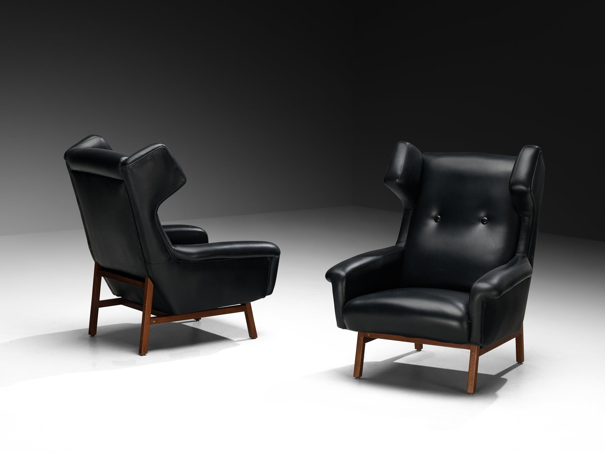 Italian Pair of Wingback Lounge Chairs in Black Leather and Mahogany Seating Morentz