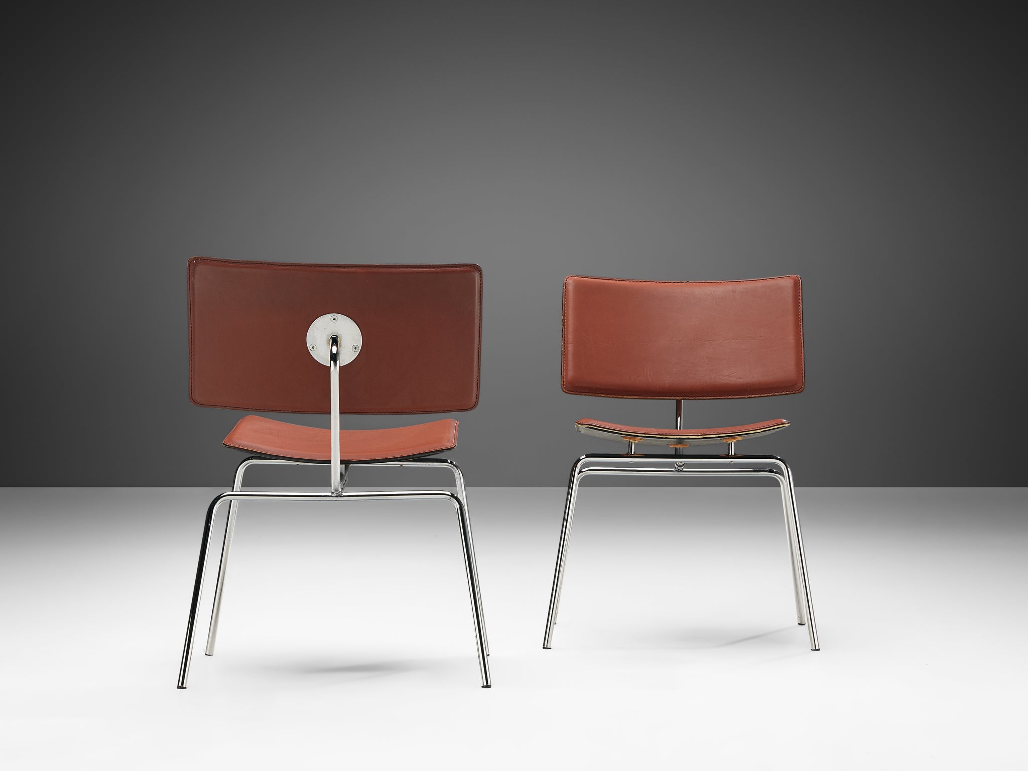 Pair of Side Chairs in Chrome and Leather seating Morentz