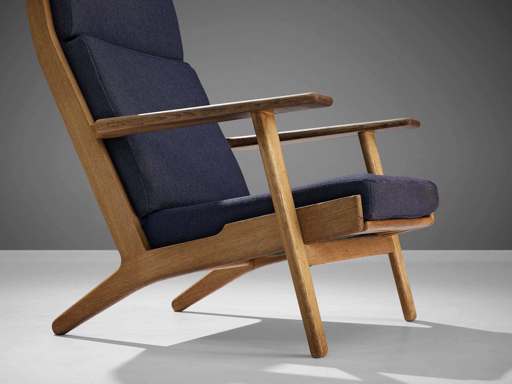 Hans J. Wegner for GETAMA Lounge Chair in Oak and Dark Blue Upholstery seating Morentz