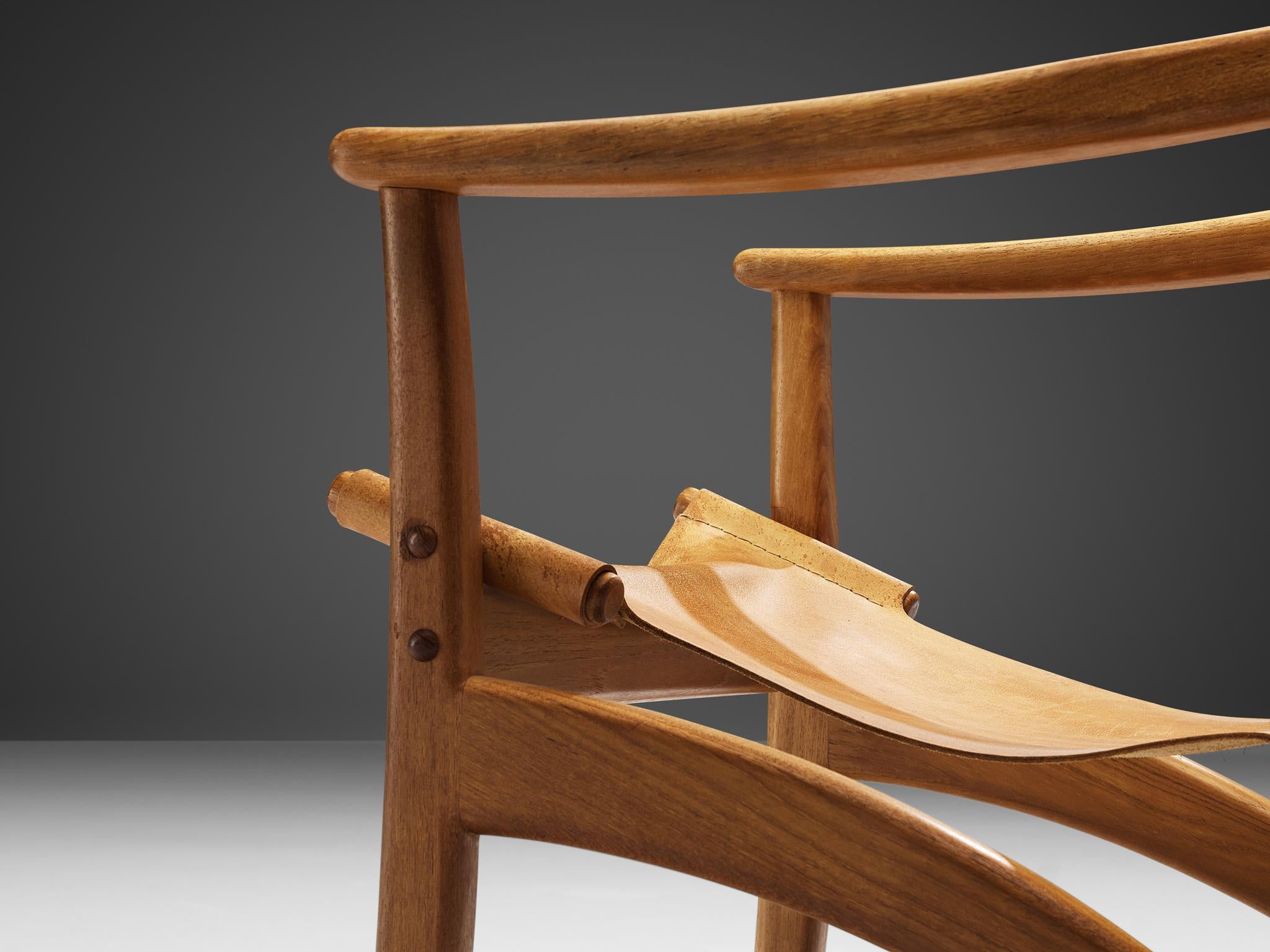 Danish Mid-Century Modern Lounge Chair in Teak and Cognac Leather seating Morentz