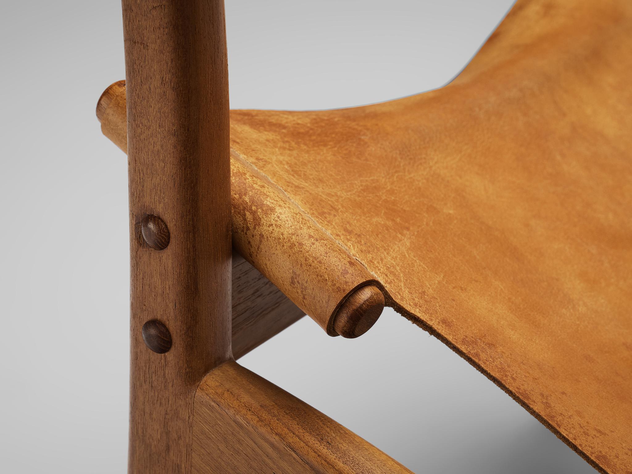 Danish Mid-Century Modern Lounge Chair in Teak and Cognac Leather seating Morentz