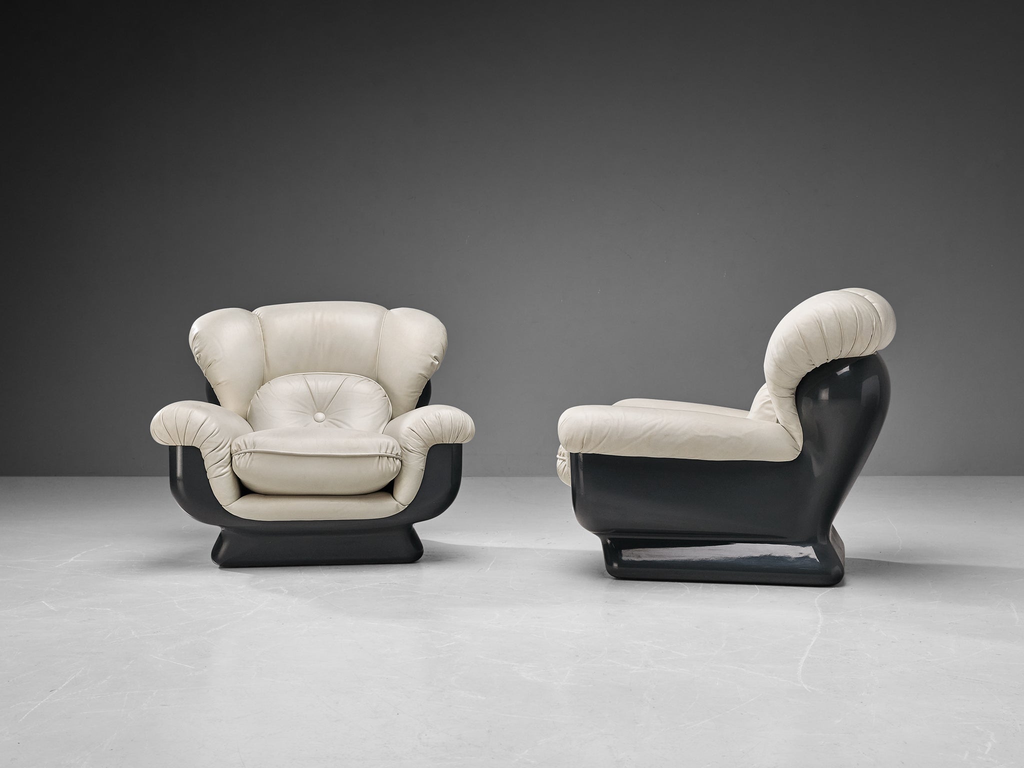 Italian Bulky Pair of Lounge Chairs in Fiberglass and Leatherette seating Morentz
