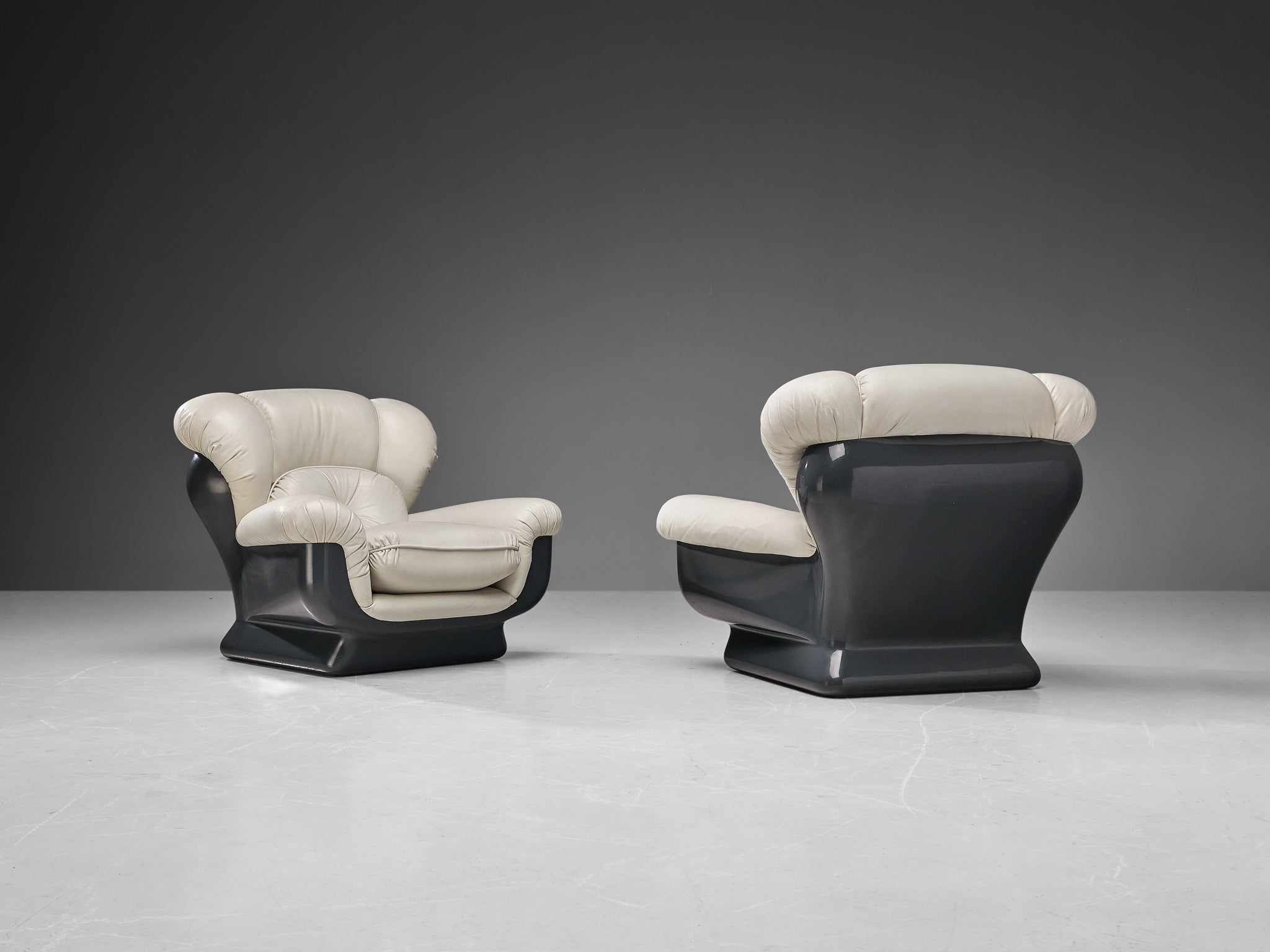 Italian Bulky Pair of Lounge Chairs in Fiberglass and Leatherette seating Morentz