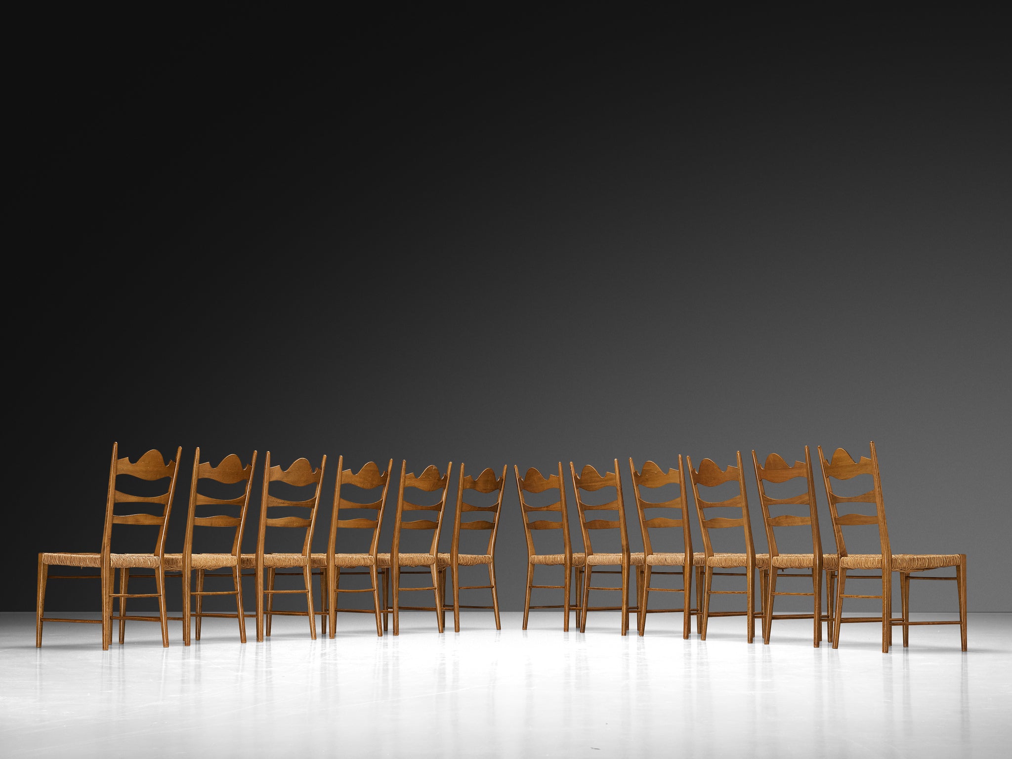 Set of Twelve Italian Dining Chairs with Carved Backs and Straw Seats