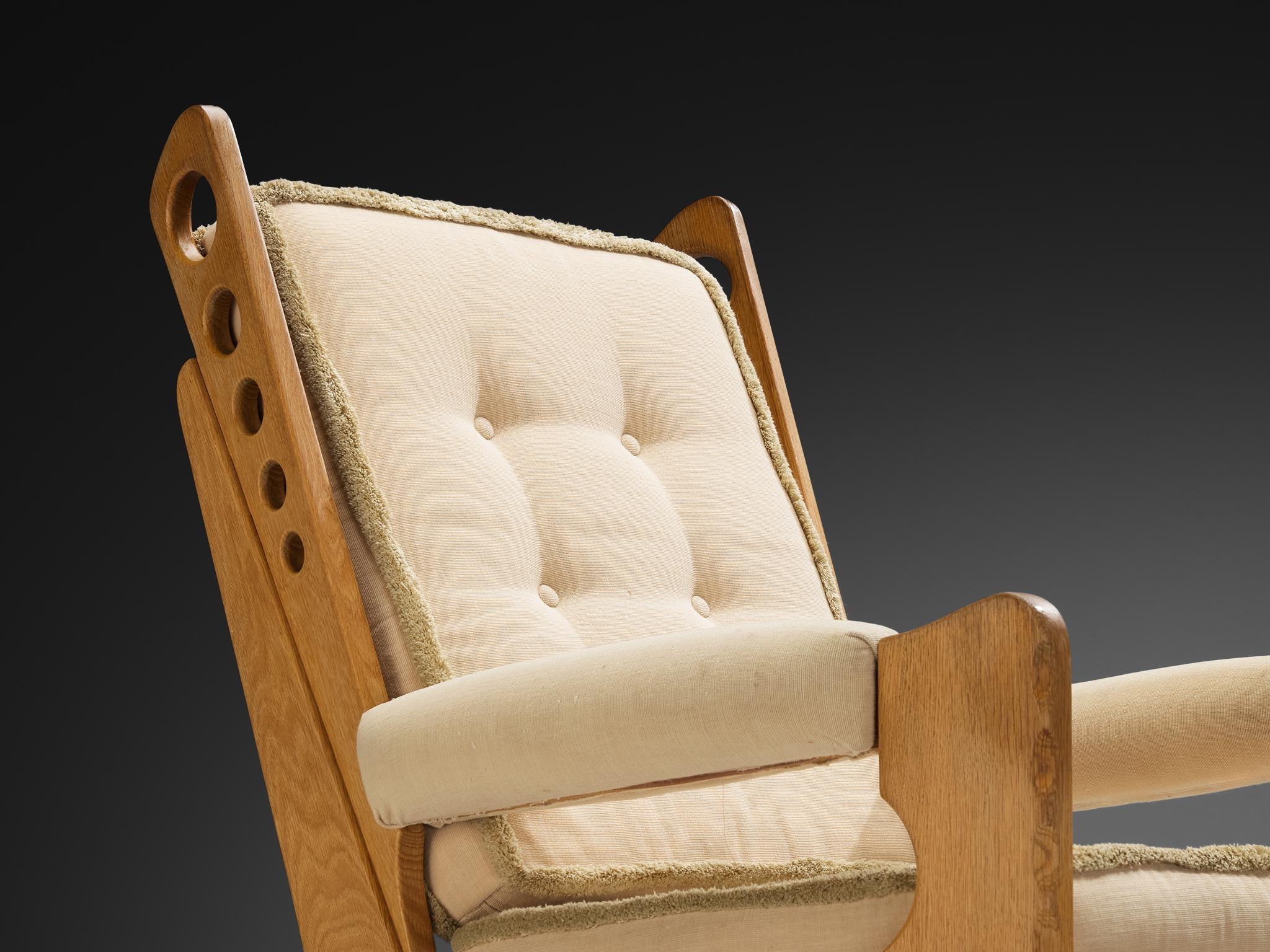 Eccentric Lounge Chair with Decorative Carvings in Oak and Beige Upholstery seating Morentz