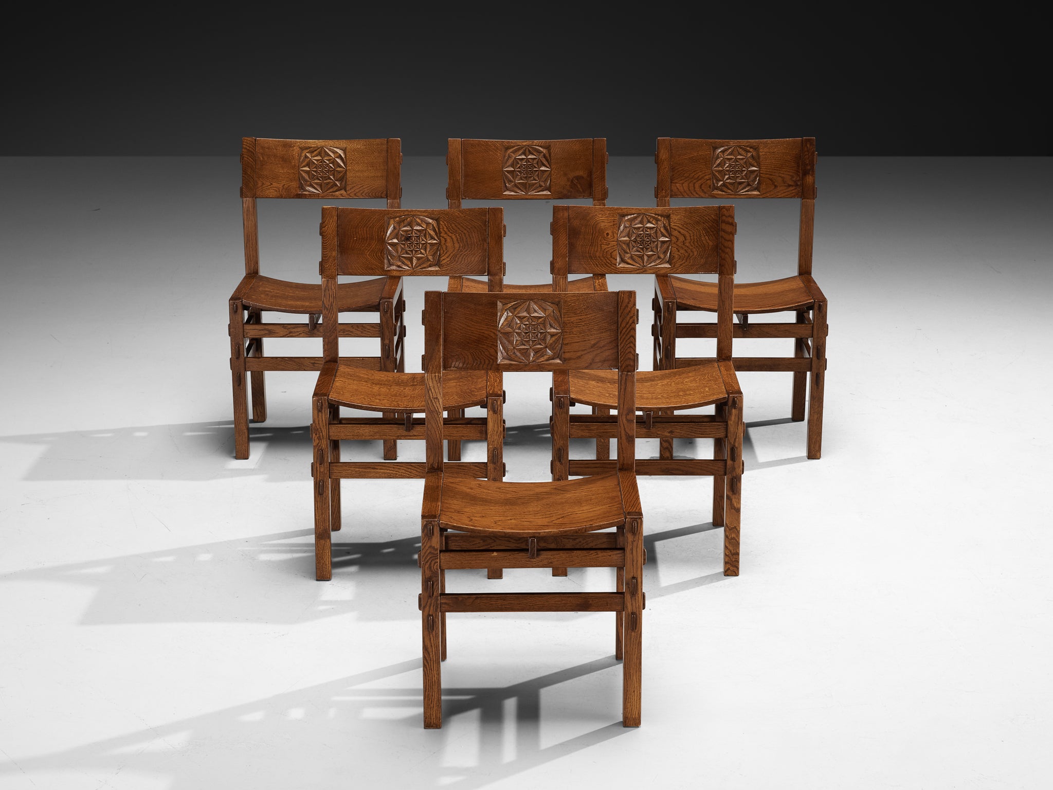 Giuseppe Rivadossi for Officina Rivadossi Dining Chairs with Carvings in Oak Seating Morentz