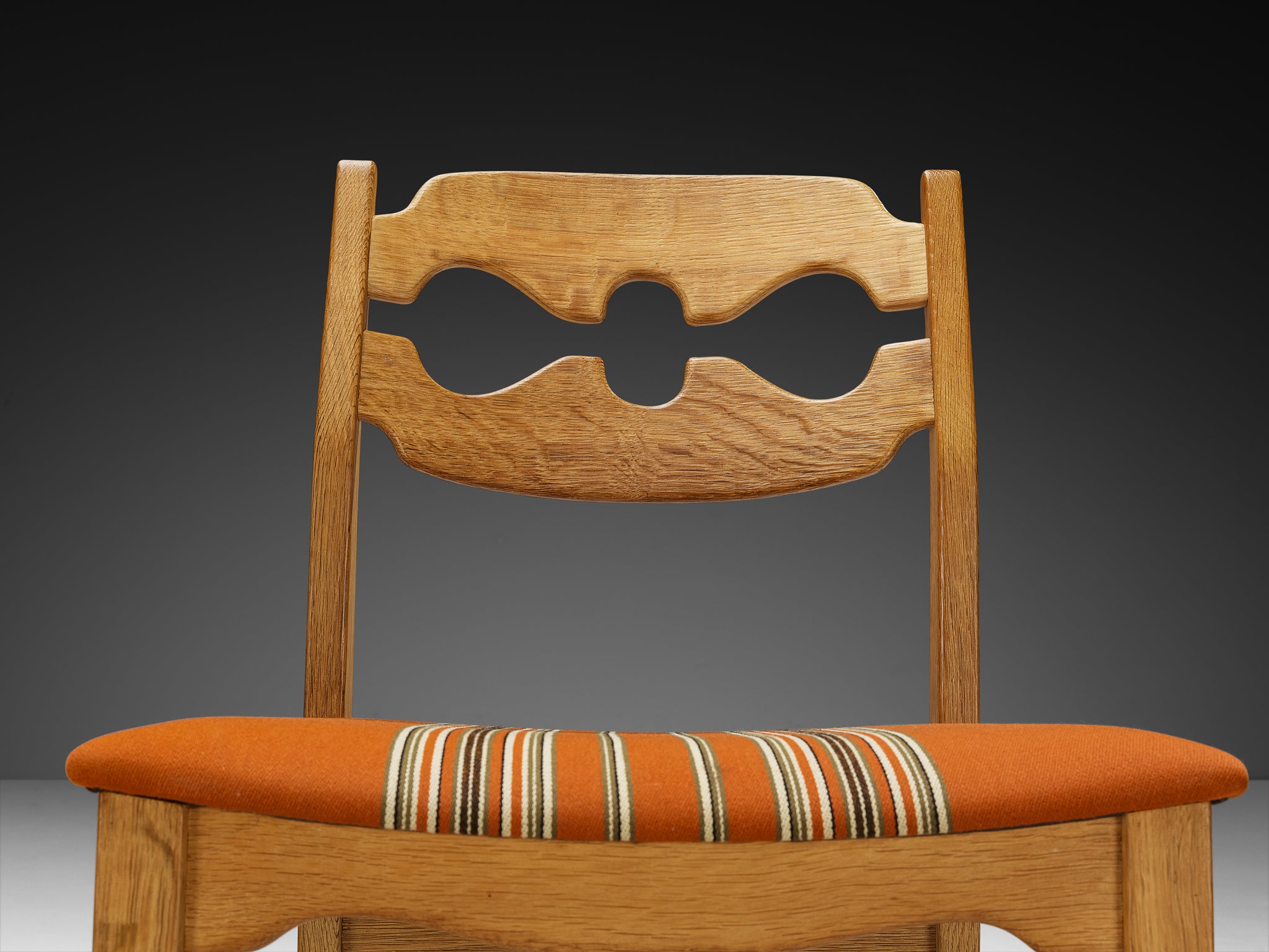 Henning Kjærnulf for Nyrup Møbelfabrik Set of Twelve Carved Dining Chairs in Solid Oak