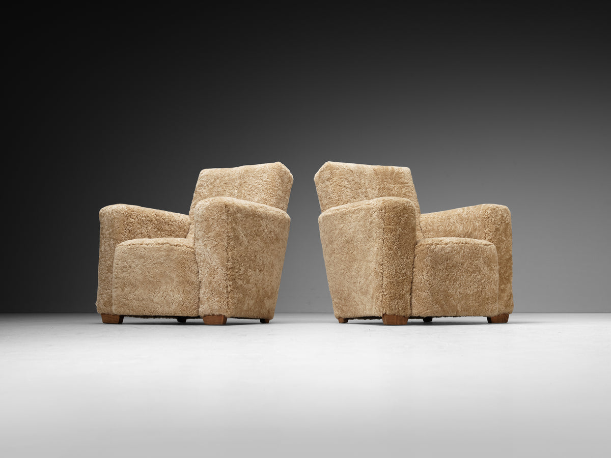 Grand Angular Art Deco Lounge Chairs Newly Upholstered in Sheepskin