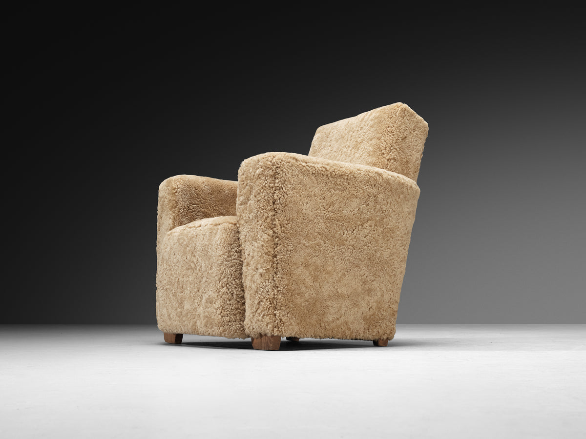 Grand Angular Art Deco Lounge Chairs Newly Upholstered in Sheepskin