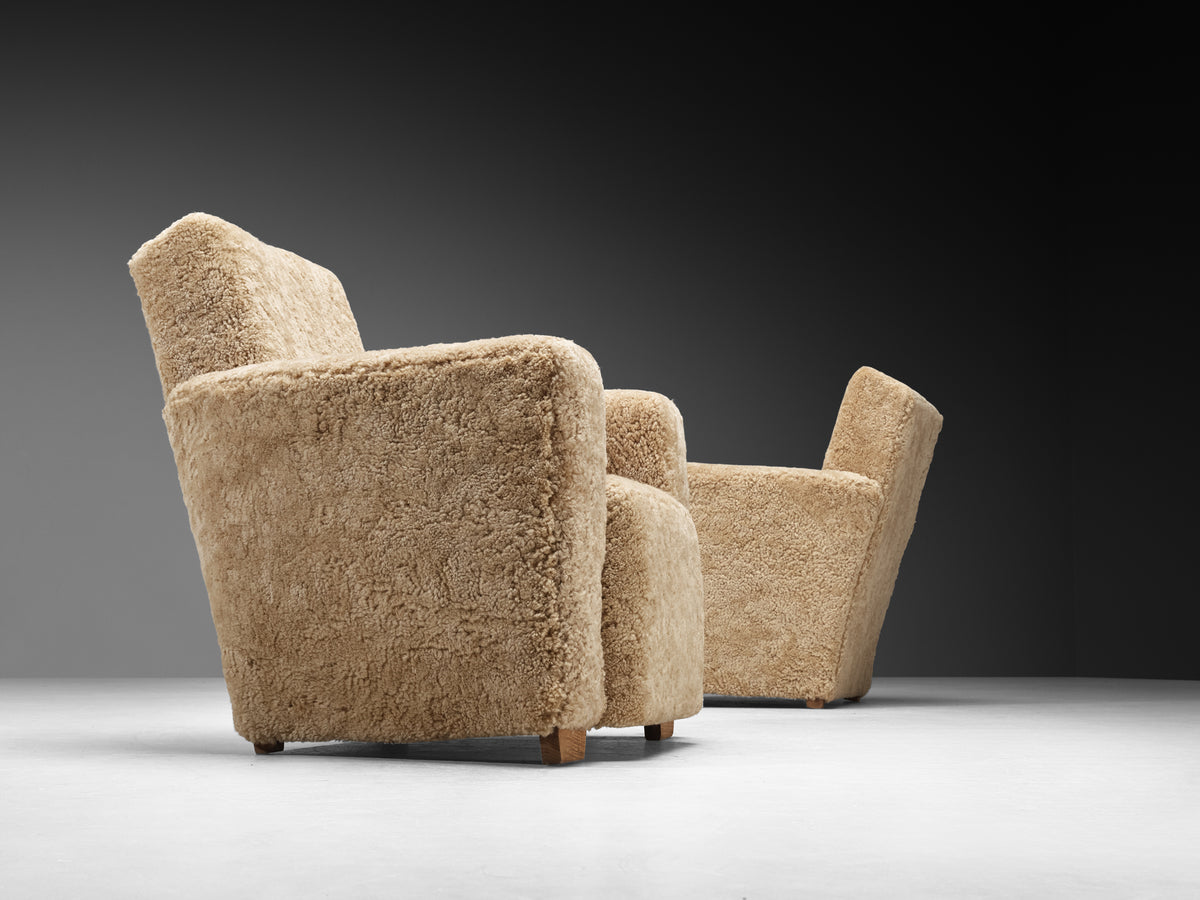Grand Angular Art Deco Lounge Chairs Newly Upholstered in Sheepskin