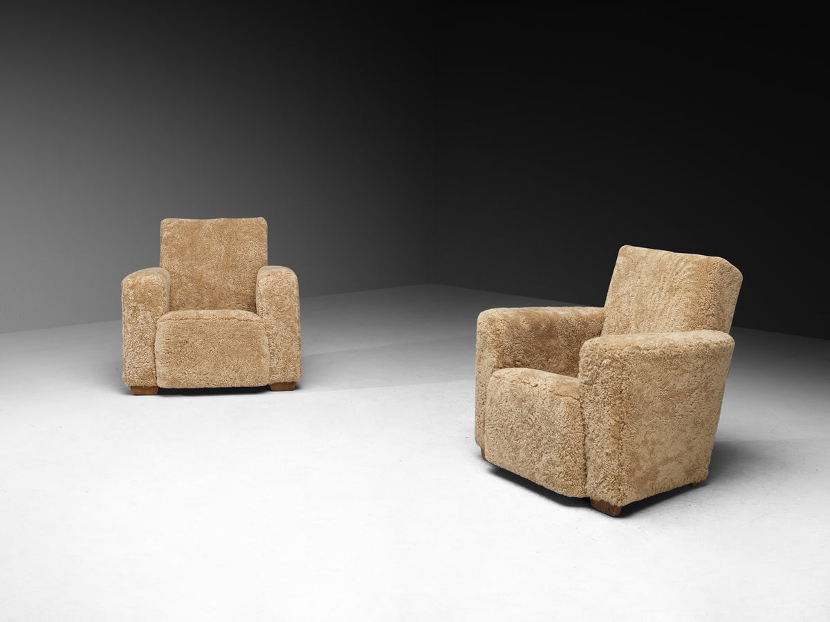 Grand Angular Art Deco Lounge Chairs Newly Upholstered in Sheepskin