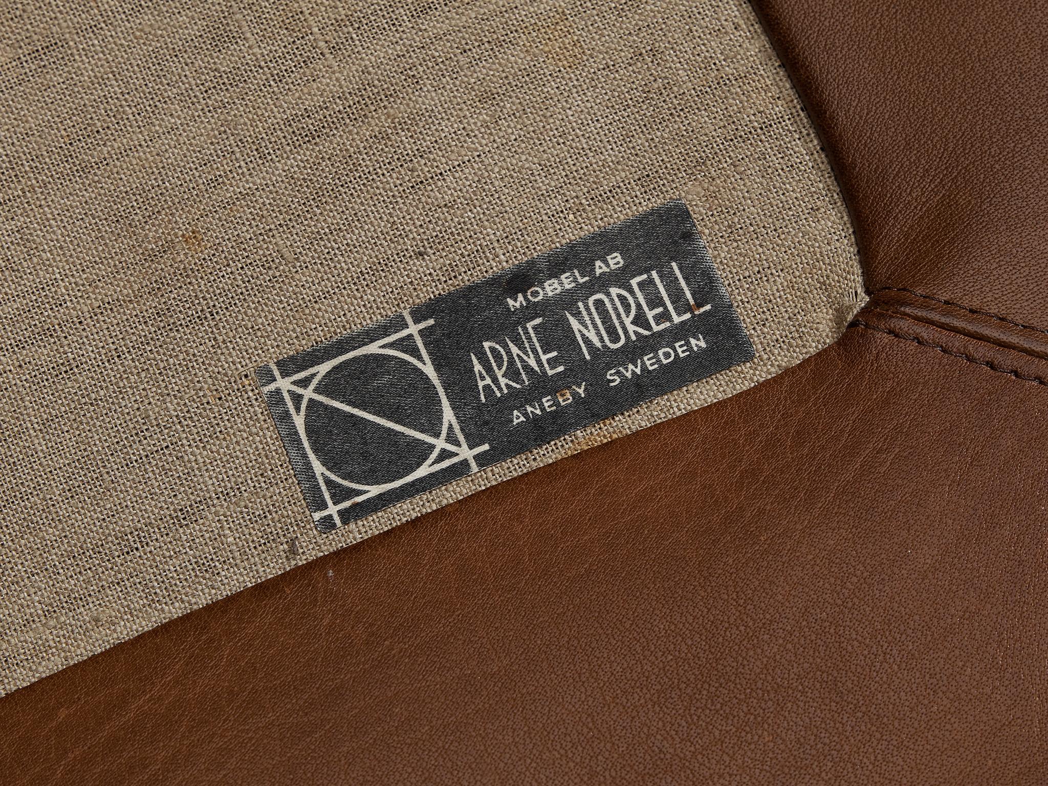 Arne Norell Ottoman 'Merkur' in Brown Leather seating Morentz