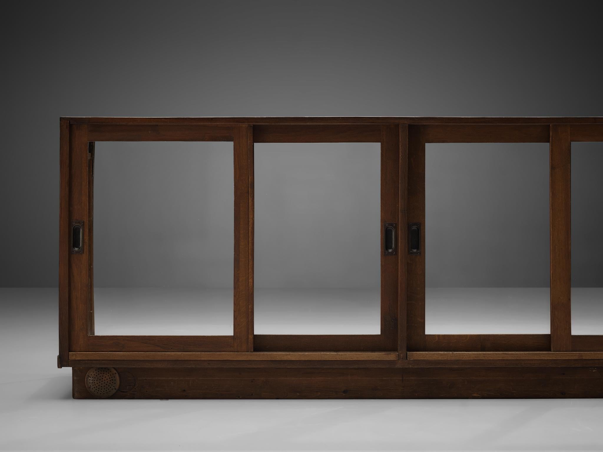 Large Art Deco Showcase in Stained Oak and Glass case pieces and storage cabinets Morentz