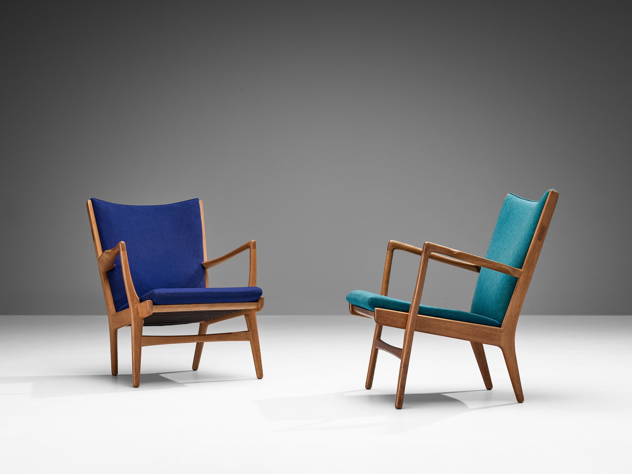 Hans Wegner Pair of Easy Chairs in Blue Upholstery and Oak