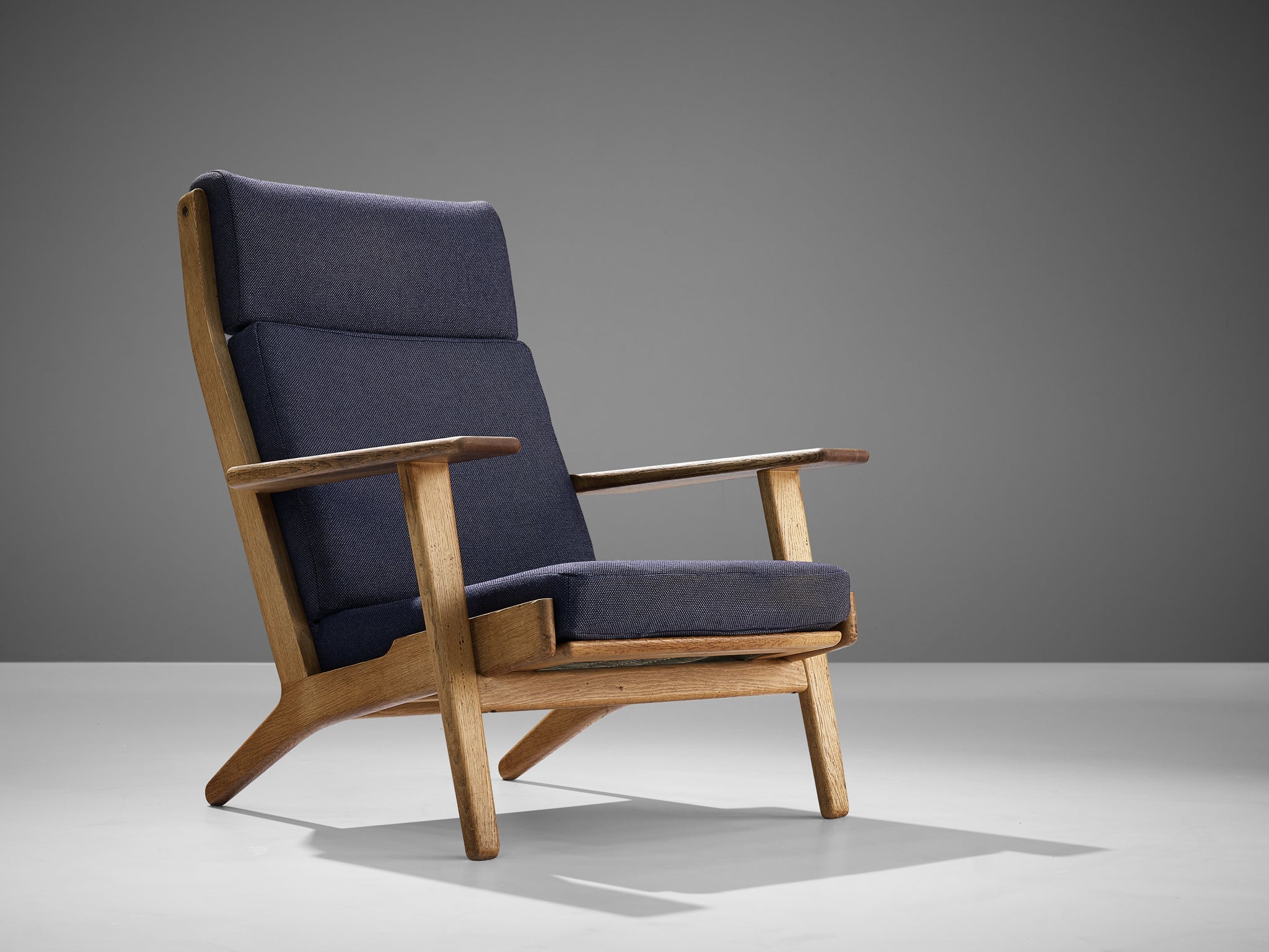 Hans J. Wegner for GETAMA Lounge Chair in Oak and Dark Blue Upholstery seating Morentz
