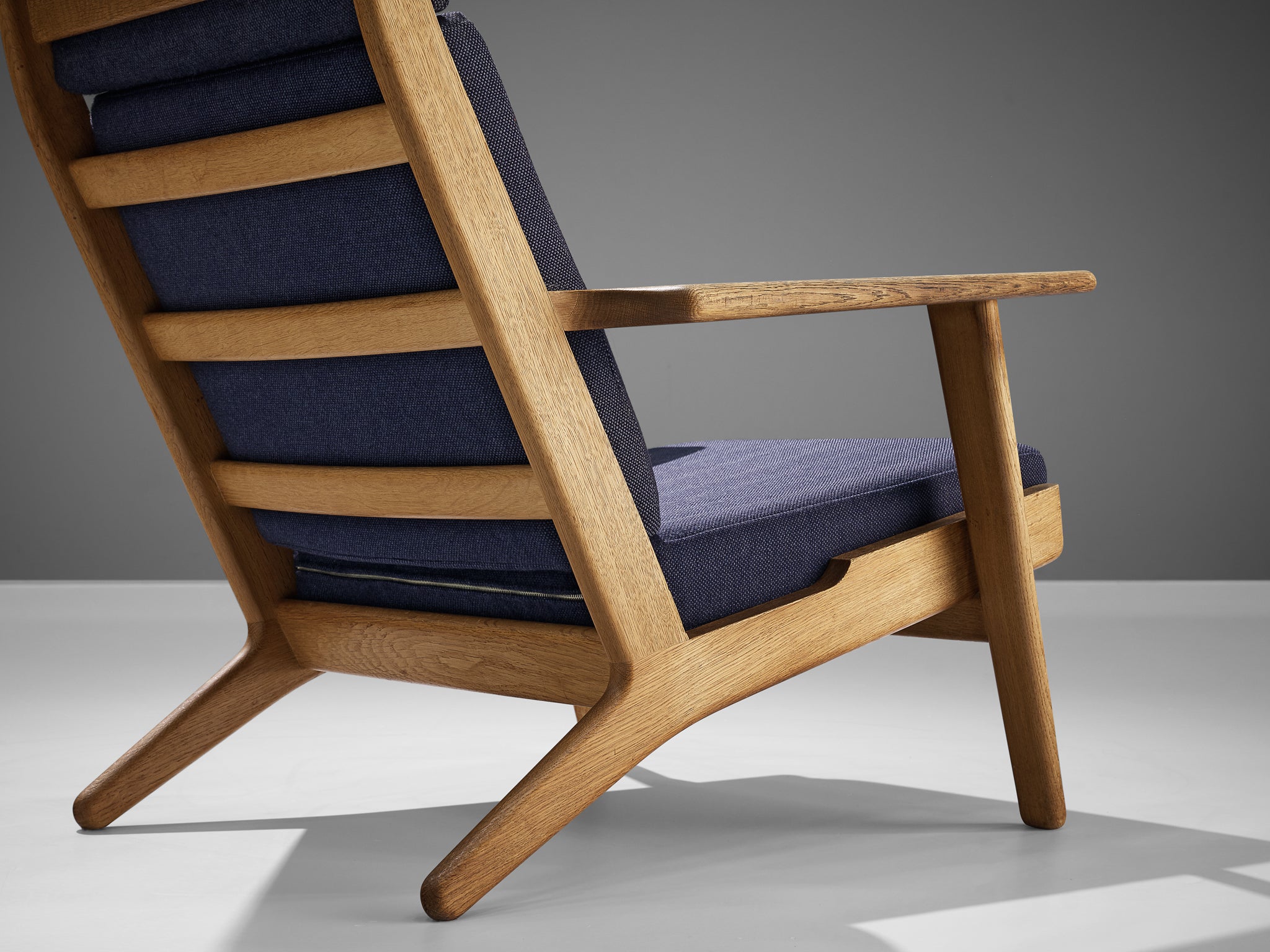 Hans J. Wegner for GETAMA Lounge Chair in Oak and Dark Blue Upholstery Seating Morentz