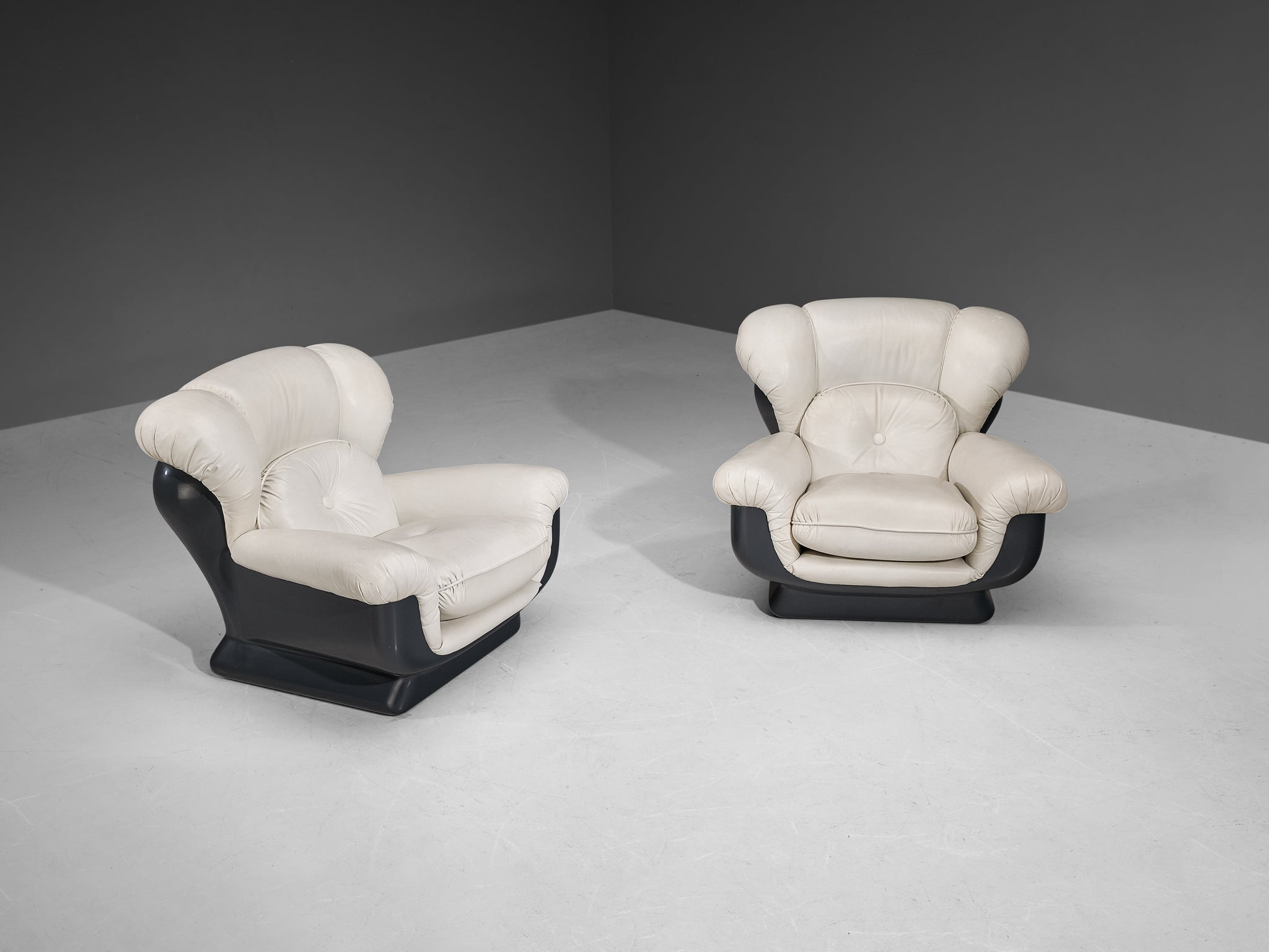 Italian Bulky Pair of Lounge Chairs in Fiberglass and Leatherette seating Morentz