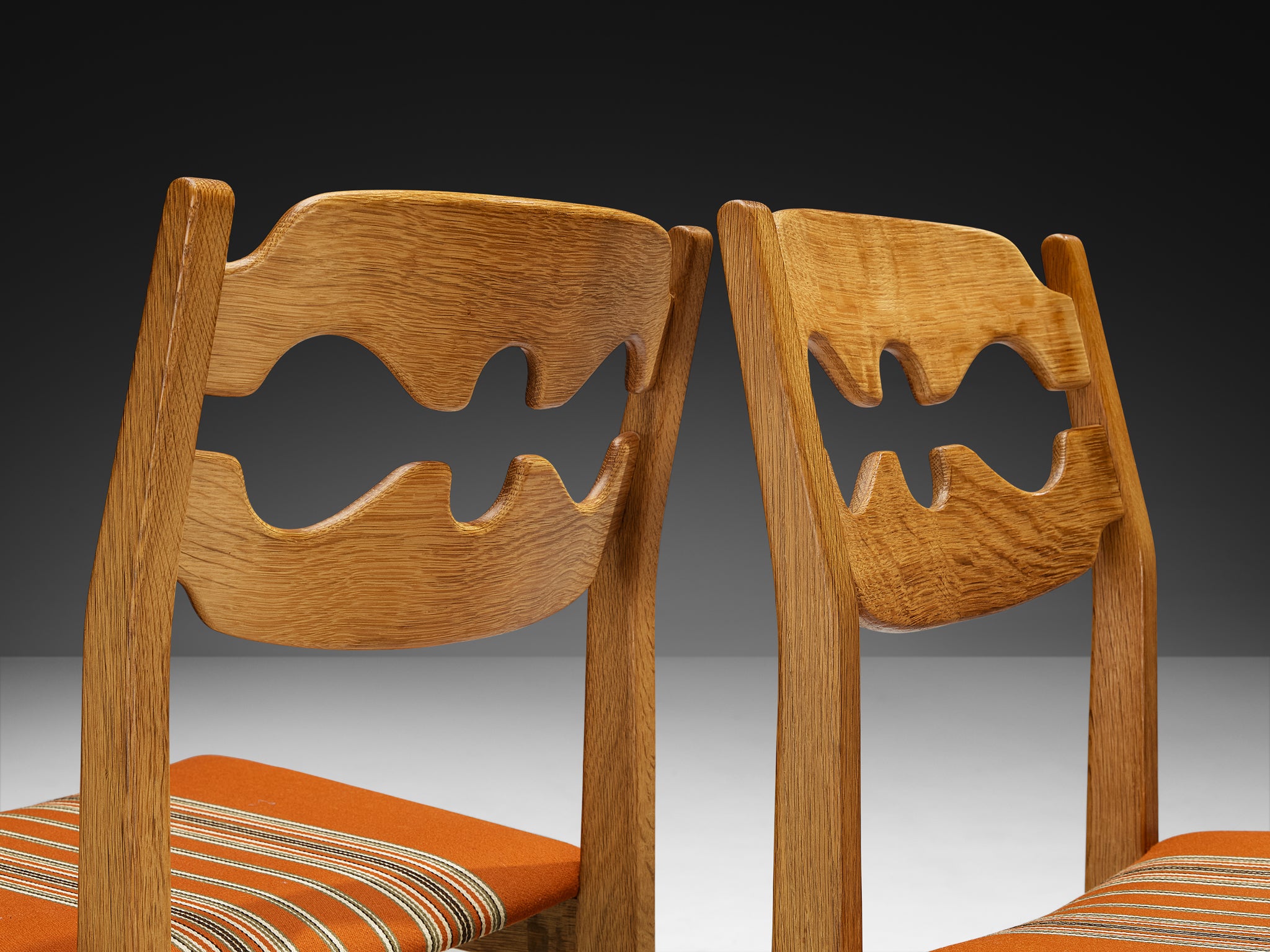 Henning Kjærnulf for Nyrup Møbelfabrik Set of Twelve Carved Dining Chairs in Solid Oak