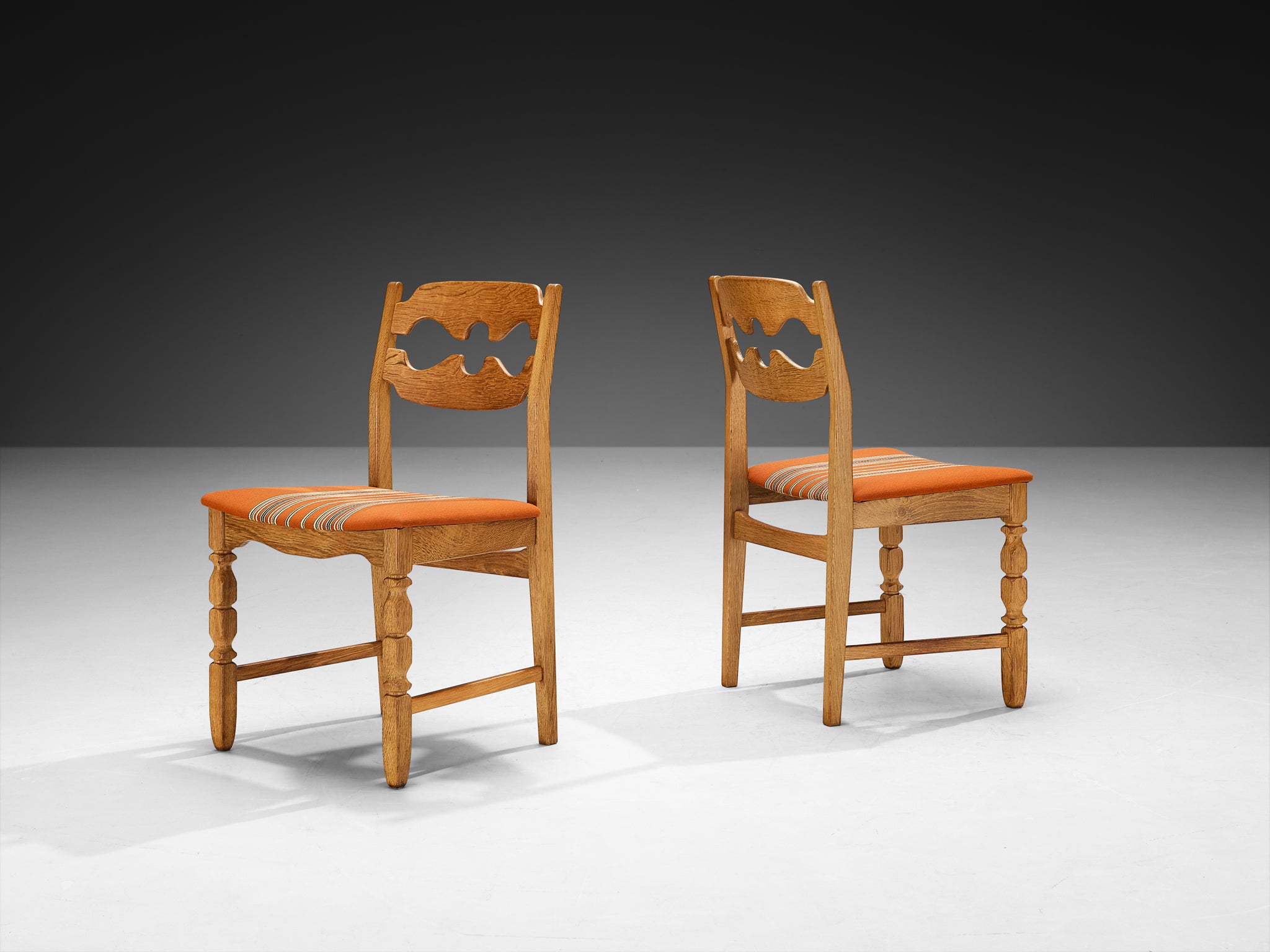 Henning Kjærnulf for Nyrup Møbelfabrik Set of Twelve Carved Dining Chairs in Solid Oak