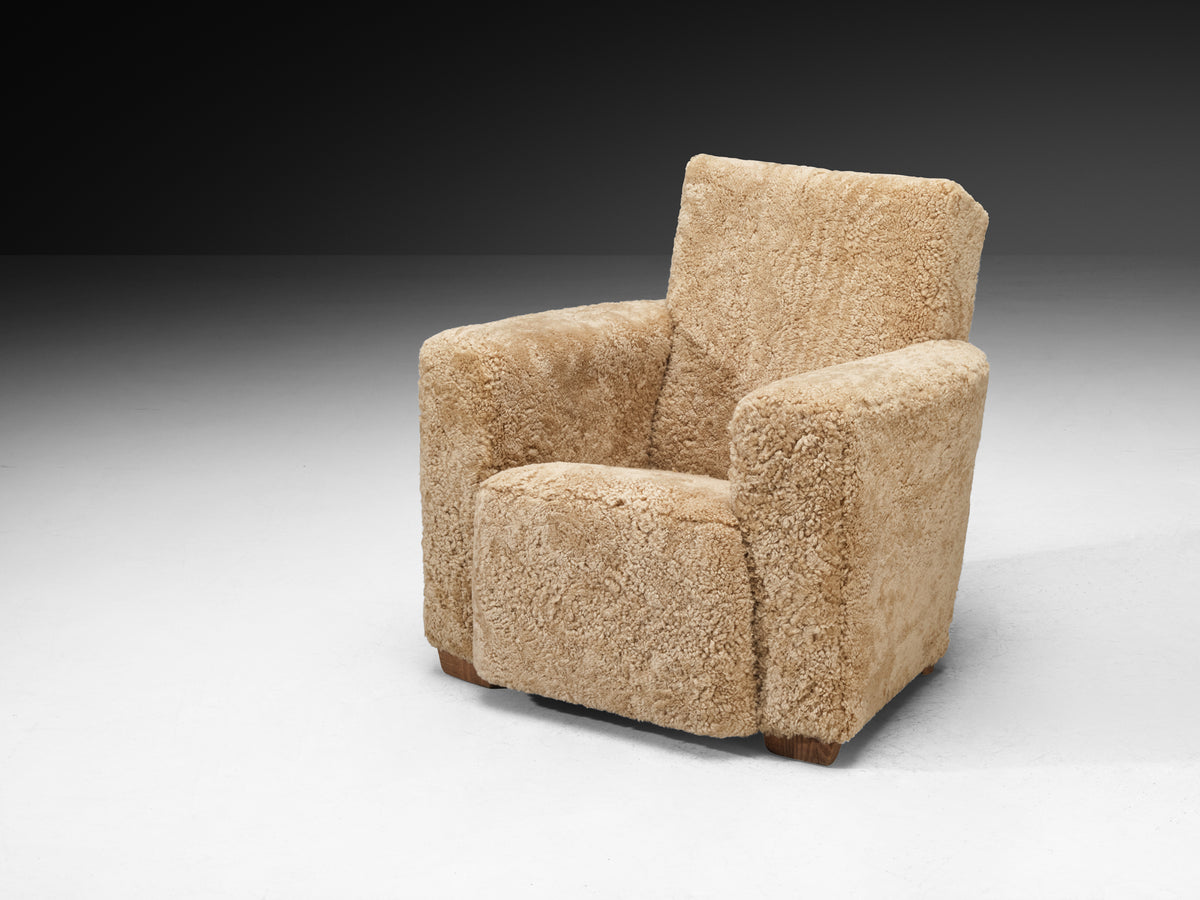 Grand Angular Art Deco Lounge Chairs Newly Upholstered in Sheepskin