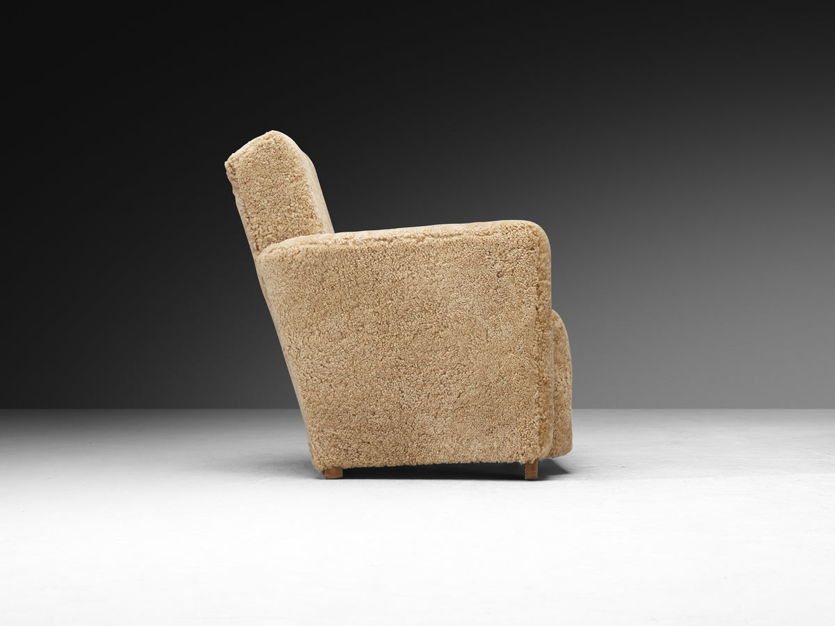 Grand Angular Art Deco Lounge Chairs Newly Upholstered in Sheepskin