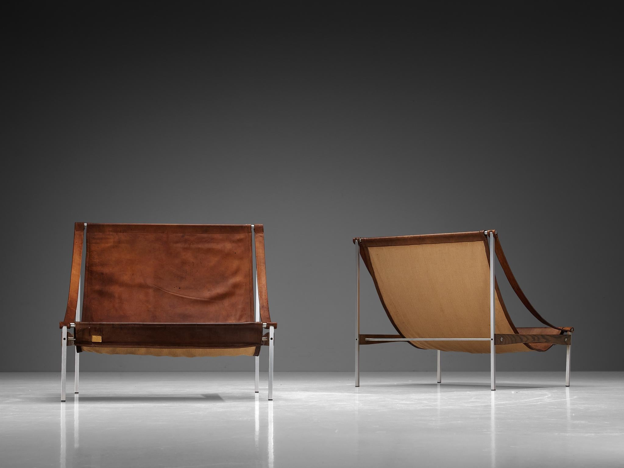 Rare Stig Poulsson Pair of 'Bequem' Lounge Chairs in Brown Leather
