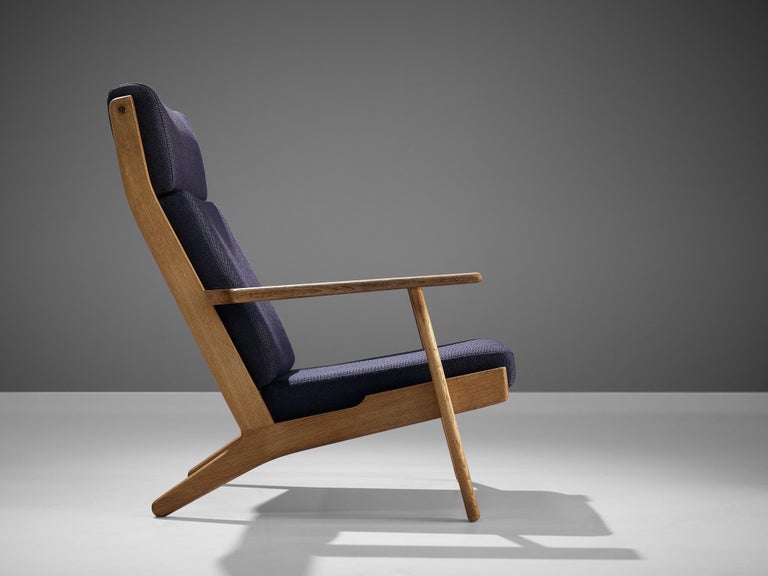 Hans J. Wegner for GETAMA Lounge Chair in Oak and Dark Blue Upholstery