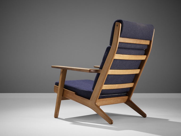 Hans J. Wegner for GETAMA Lounge Chair in Oak and Dark Blue Upholstery