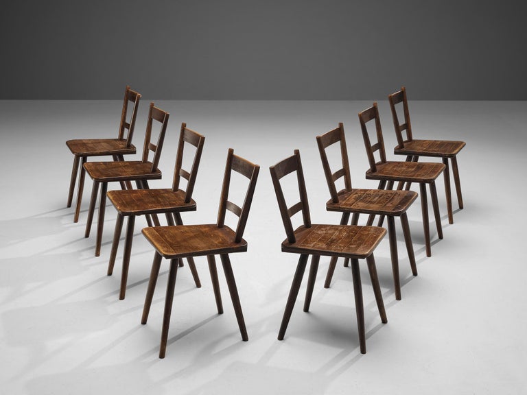 Set of Eight French Pastoral Dining Chairs in Stained Wood